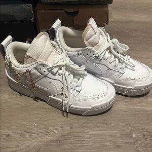 Nike White Sneakers with Gold Details